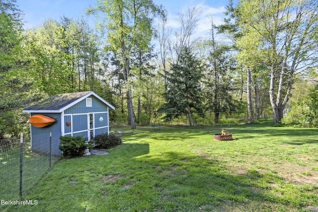 110 Maple Grove Dr, Pittsfield, MA 01201 - view of yard with a fire pit, an outbuilding, and a storage unit