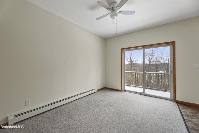 spare room with a baseboard heating unit, carpet floors, and ceiling fan