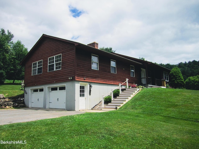 805 Savoy Rd, Cheshire, MA 01225 - view of front of property featuring a garage, a chimney, a front lawn, and driveway