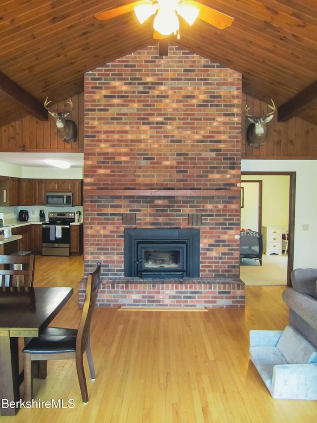 805 Savoy Rd, Cheshire, MA 01225 - living area featuring ceiling fan, high vaulted ceiling, light wood-style flooring, a fireplace, and a wood ceiling with exposed beams