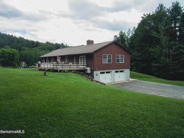 805 Savoy Rd, Cheshire, MA 01225 - view of front of house featuring a garage, asphalt driveway, a chimney, a front yard, and a wooden deck