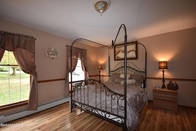 131 Wilshire Dr, Cheshire, MA 01225 - bedroom featuring wood finished floors and a baseboard heating unit
