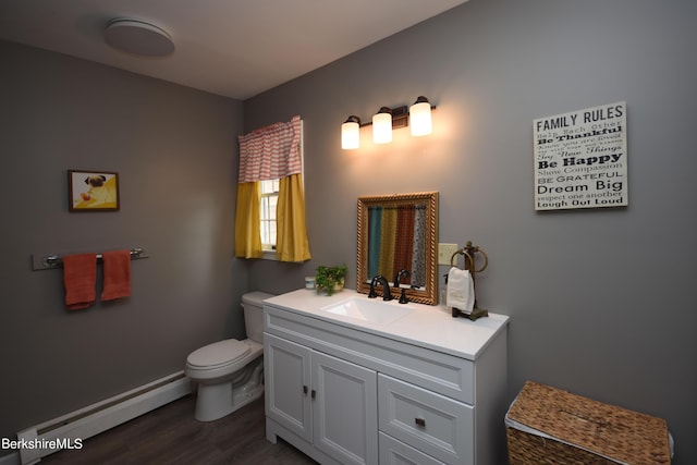 131 Wilshire Dr, Cheshire, MA 01225 - half bathroom with toilet, a baseboard radiator, wood finished floors, and vanity