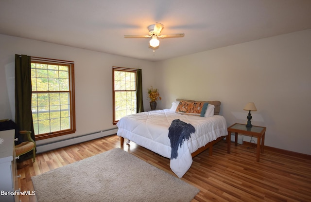 131 Wilshire Dr, Cheshire, MA 01225 - bedroom featuring wood finished floors, a baseboard heating unit, ceiling fan, and baseboards