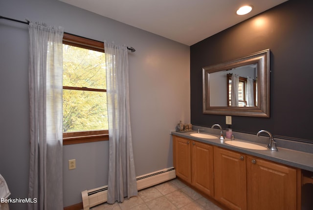 131 Wilshire Dr, Cheshire, MA 01225 - bathroom featuring tile patterned floors, double vanity, a baseboard heating unit, and a sink