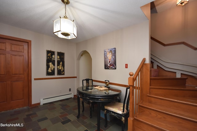 131 Wilshire Dr, Cheshire, MA 01225 - dining area featuring arched walkways, stairway, and a baseboard radiator