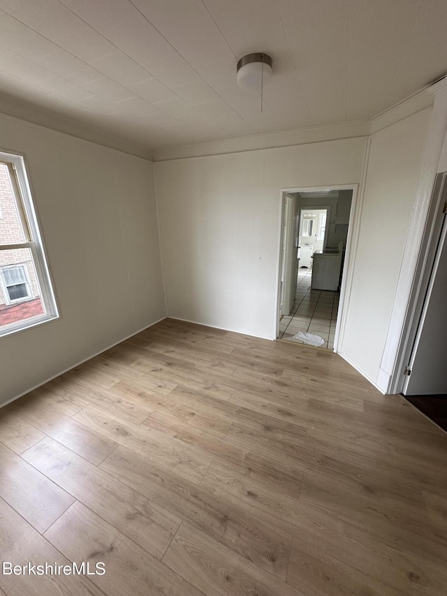 unfurnished room with light hardwood / wood-style floors