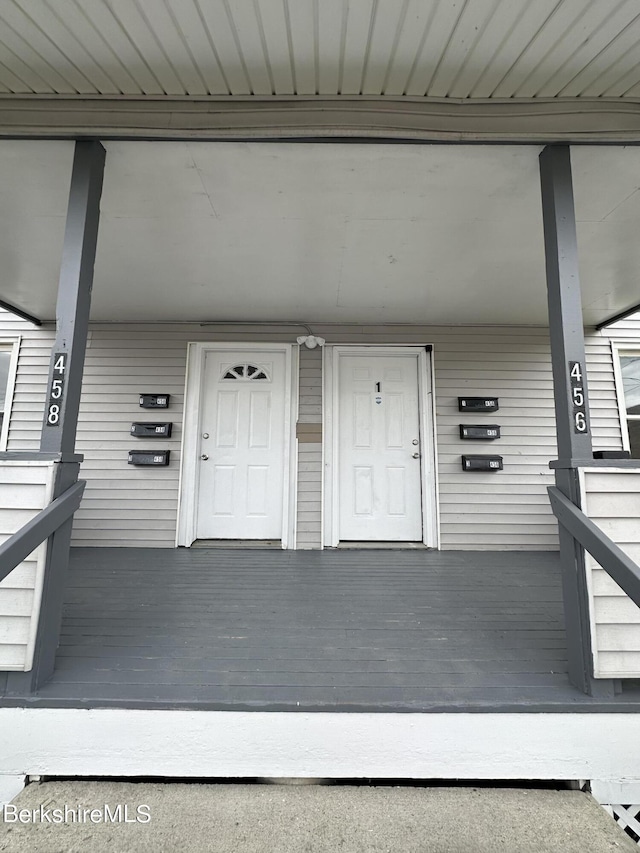 doorway to property featuring covered porch