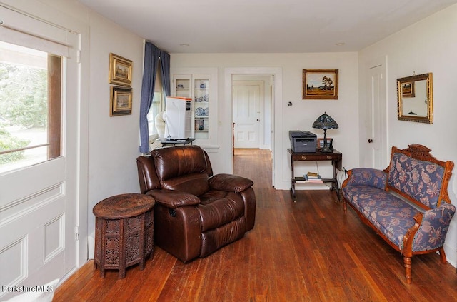 sitting room featuring dark hardwood / wood-style floors