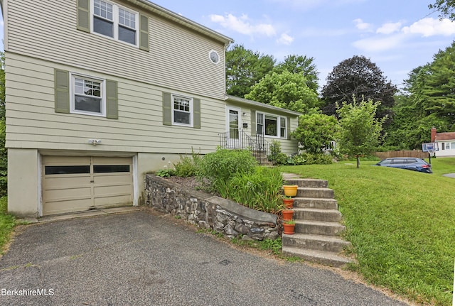 127 Gamwell Ave, Pittsfield, MA 01201 - view of front of property featuring an attached garage, a front yard, and asphalt driveway