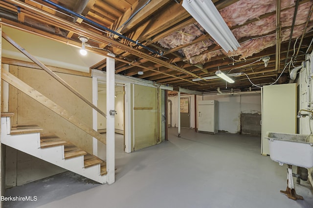 127 Gamwell Ave, Pittsfield, MA 01201 - unfinished basement with stairs and refrigerator