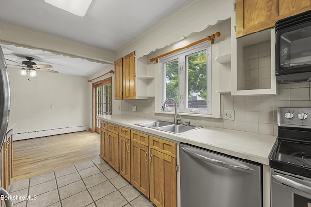 127 Gamwell Ave, Pittsfield, MA 01201 - kitchen featuring stainless steel appliances, a baseboard radiator, open shelves, and light countertops