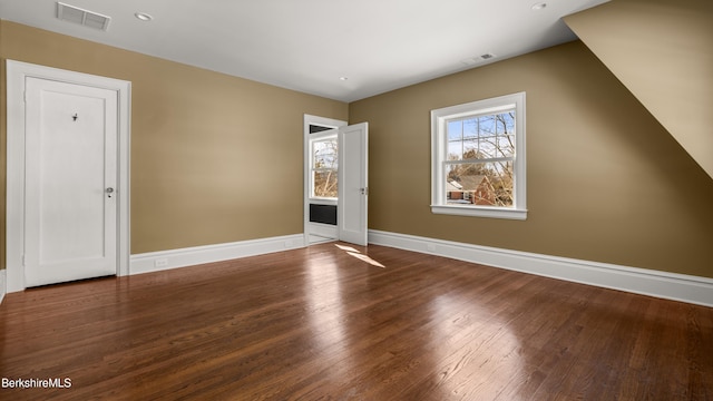 interior space with recessed lighting, visible vents, baseboards, and wood finished floors