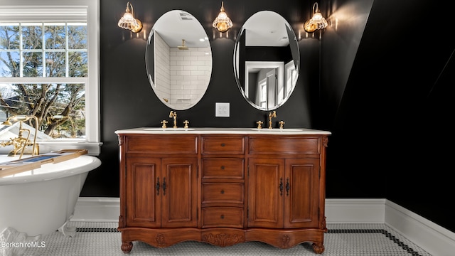 full bath featuring tile patterned floors, a sink, and double vanity