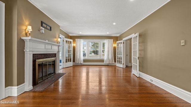 unfurnished living room with french doors, baseboards, a brick fireplace, and wood finished floors