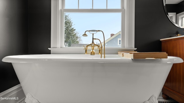 interior details featuring a freestanding bath