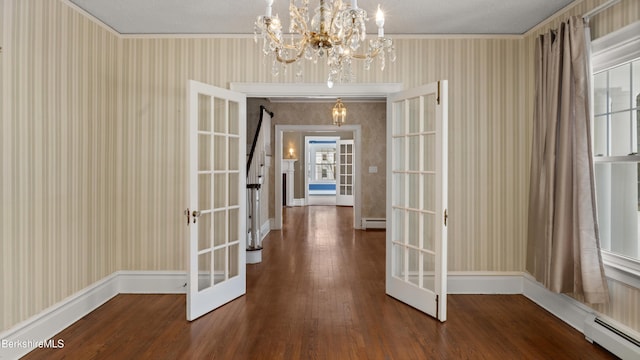 corridor featuring french doors, a baseboard heating unit, and wallpapered walls