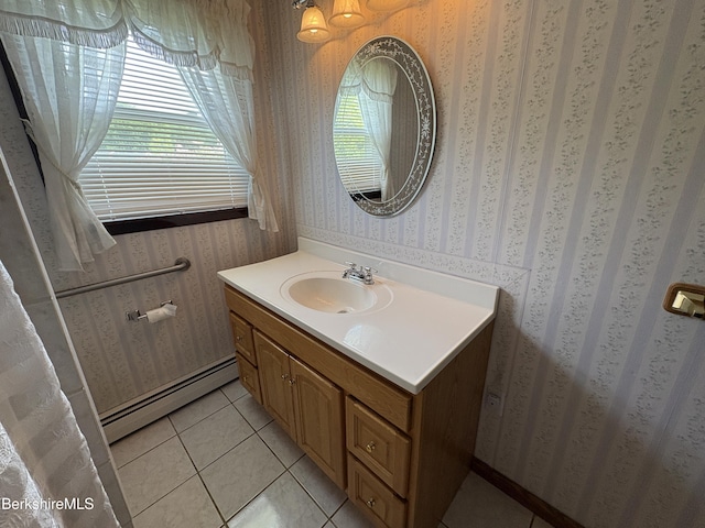184 Mcintosh Dr, Pittsfield, MA 01201 - bathroom featuring a baseboard heating unit, vanity, wallpapered walls, and tile patterned floors