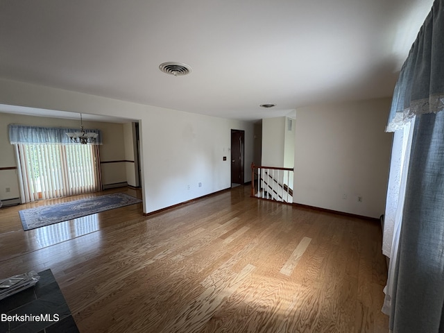 184 Mcintosh Dr, Pittsfield, MA 01201 - empty room featuring a chandelier and wood finished floors