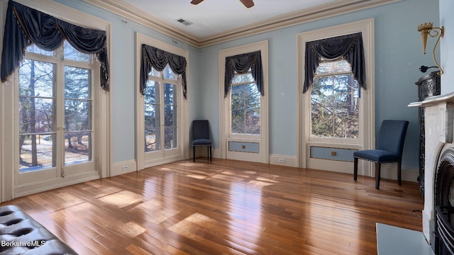 6 Eileen Dr, Rensselaer, NY 12144 - doorway featuring visible vents, plenty of natural light, wood finished floors, and crown molding