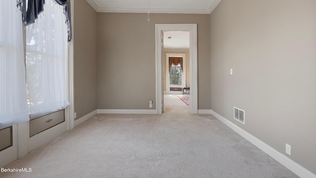 6 Eileen Dr, Rensselaer, NY 12144 - unfurnished room featuring baseboards, visible vents, attic access, ornamental molding, and light carpet