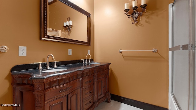 6 Eileen Dr, Rensselaer, NY 12144 - bathroom featuring a sink, baseboards, and double vanity