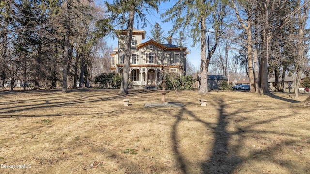 6 Eileen Dr, Rensselaer, NY 12144 - rear view of house with a lawn