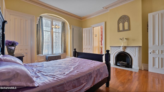 6 Eileen Dr, Rensselaer, NY 12144 - bedroom with a fireplace with flush hearth, wood finished floors, and ornamental molding