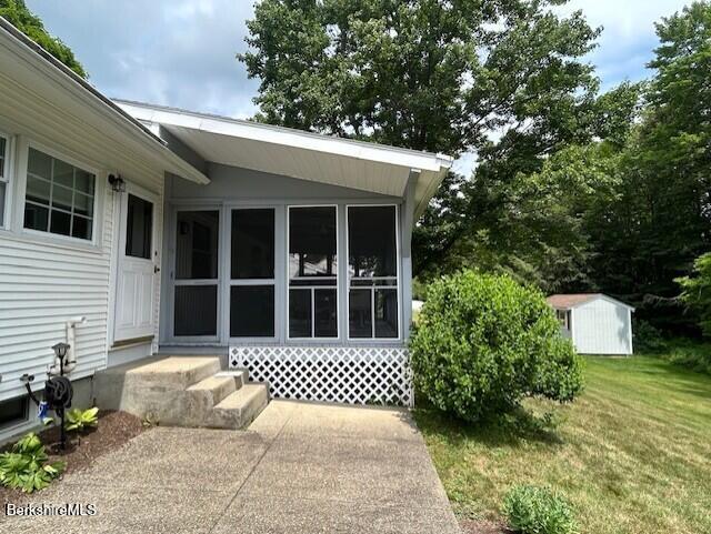 62 Maple Grove Dr, Pittsfield, MA 01201 - view of exterior entry featuring a lawn