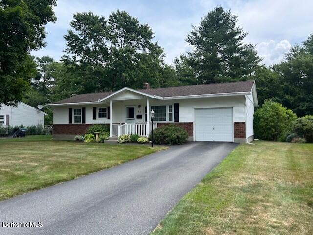 62 Maple Grove Dr, Pittsfield, MA 01201 - ranch-style house featuring brick siding, an attached garage, a porch, and a front yard