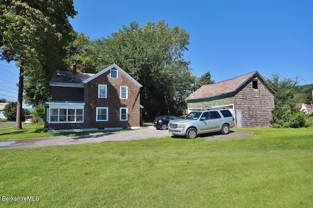 view of side of property with a yard