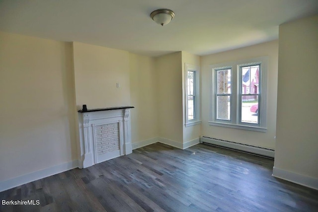 unfurnished living room with baseboard heating and dark hardwood / wood-style floors