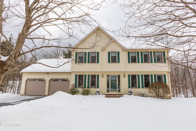 colonial home featuring a garage