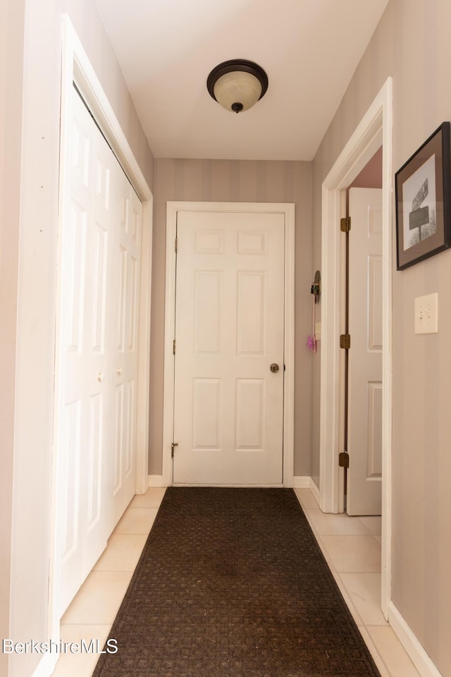 hallway with light tile patterned floors