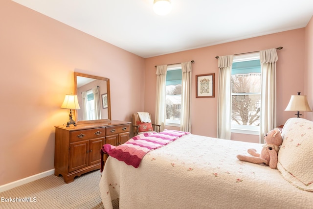 bedroom featuring light carpet