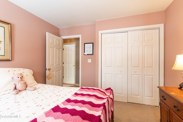 carpeted bedroom featuring a closet