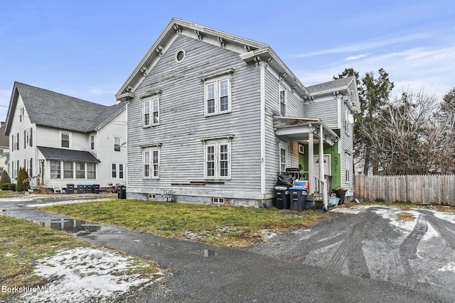 view of side of property with a yard