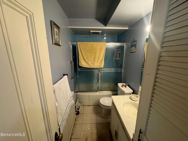 79 Chestnut St, North Adams, MA 01247 - full bath featuring toilet, visible vents, tile patterned flooring, vanity, and combined bath / shower with glass door
