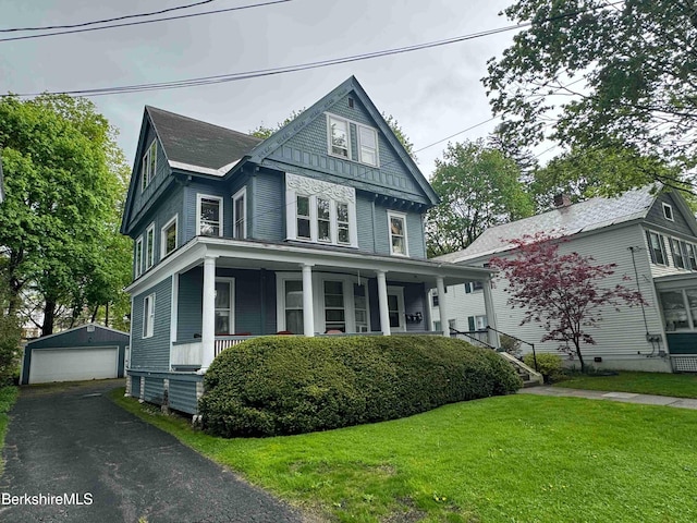 79 Chestnut St, North Adams, MA 01247 - victorian-style house featuring covered porch, a front yard, an outbuilding, and a garage