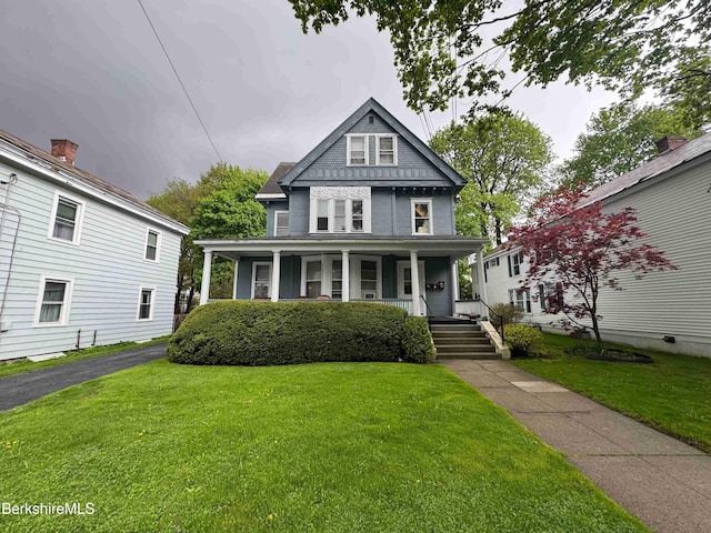 79 Chestnut St, North Adams, MA 01247 - victorian home featuring a porch and a front lawn