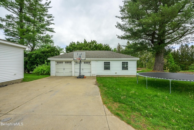 955 Barker Rd, Pittsfield, MA 01201 - view of front of home with a trampoline, an outbuilding, a garage, a front yard, and roof with shingles