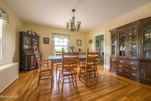 955 Barker Rd, Pittsfield, MA 01201 - dining space featuring a chandelier, radiator, and wood finished floors