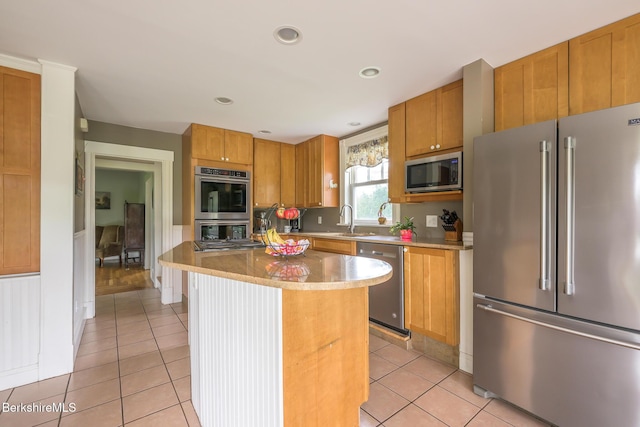 955 Barker Rd, Pittsfield, MA 01201 - kitchen with appliances with stainless steel finishes, a sink, light tile patterned floors, a kitchen island, and recessed lighting