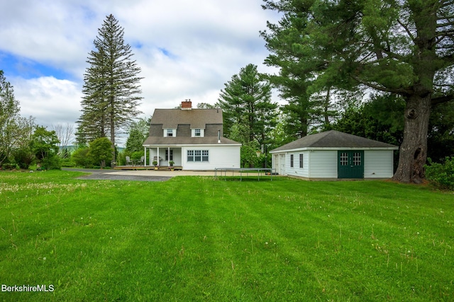 955 Barker Rd, Pittsfield, MA 01201 - back of property with an outdoor structure, a lawn, and a chimney