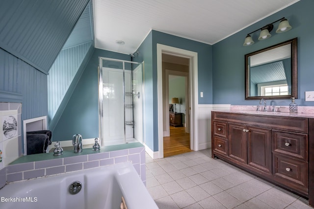 955 Barker Rd, Pittsfield, MA 01201 - bathroom with vanity, a shower stall, a garden tub, tile patterned floors, and a wainscoted wall
