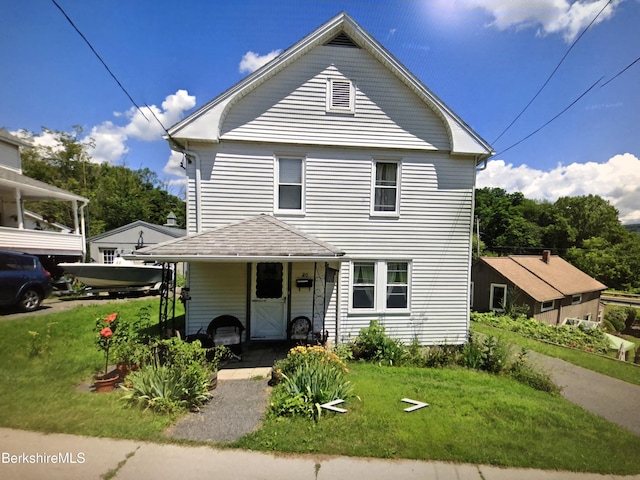 20 Summer St, Lee, MA 01238 - view of front facade with a shingled roof and a front lawn