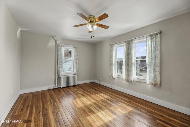 20 Summer St, Lee, MA 01238 - unfurnished room with hardwood / wood-style flooring, radiator, baseboards, and a ceiling fan