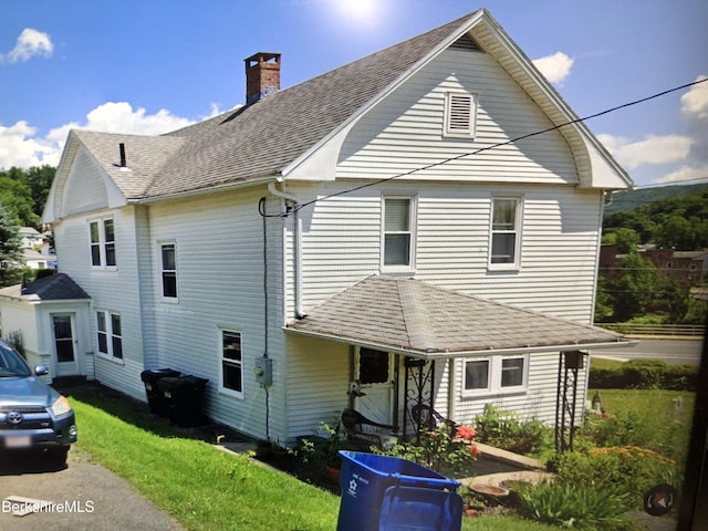 20 Summer St, Lee, MA 01238 - rear view of house with a yard, a shingled roof, and a chimney