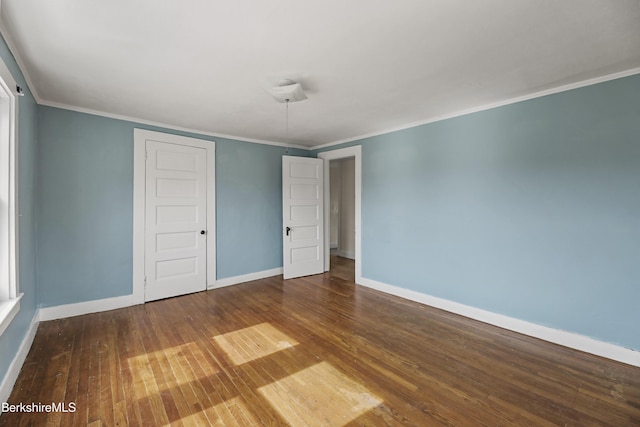 20 Summer St, Lee, MA 01238 - unfurnished bedroom with baseboards, crown molding, hardwood / wood-style floors, and a closet