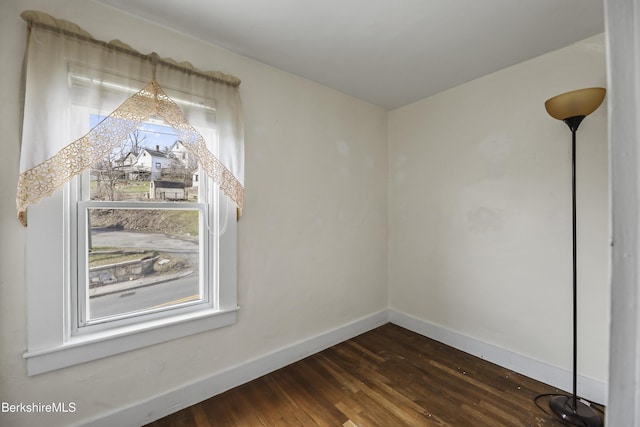 20 Summer St, Lee, MA 01238 - unfurnished dining area featuring baseboards and dark wood-style flooring